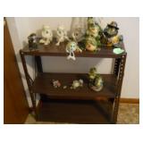 metal shelf and frog figurines 