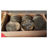 Tins of various model train parts