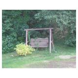 well loved wooden swing