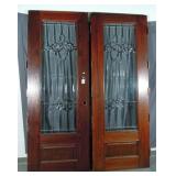 TWO STAINED OAK AND LEADED GLASS DOORS