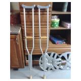 2 PAIRS OF CRUTCHES, SEVERAL HUB CAPS, CABINETS & MISC.