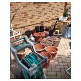 LOTS OF HOSE REELS AND LOTS OF HOSES, LOTS OF POTS & PLANTERS TOO