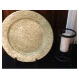 Decorative plate on stand and candle