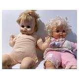#62  2 baby dolls and 2 bags of baby doll or baby clothes