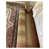 4 matching braided wool rugs