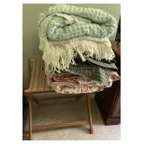 lots of comforters, spreads, and linens