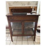 glass front and shelves cabinet