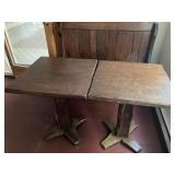 pair of dark pine tables