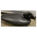 black wooden decoy 
