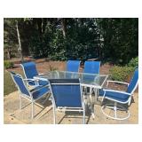 METAL PATIO TABLE WITH GLASS TOP AND SIX CHAIRS