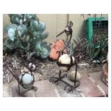 Iron and rock yard art 