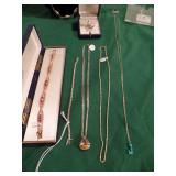 14K gold and garnet bracelet, 14K gold tennis bracelet, sterling necklace, the two necklaces on the 