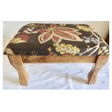 Upholstered stool.