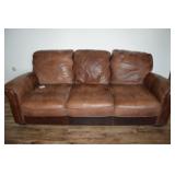 Leather Sofa with Overstuffed Cushions and Brass Tack Detailing