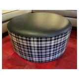 24) Upholstered Round Ottoman in Ralph Lauren "Upton Tartan" and Cowhide in "Lacar Black". 36"d