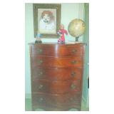 Mahogany chest, clown art, and illuminated globe
