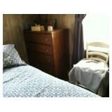 Four-drawer dresser and small chair.