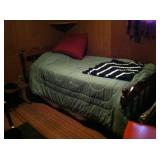 Twin-sized bed with good wood headboard.