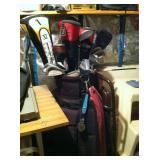 One of two sets of golf clubs.