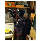 One of two sets of golf clubs.