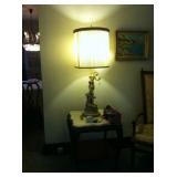 Stone-topped table with mythological lamp