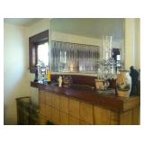 Small decorative items include a collection of Grecian vases