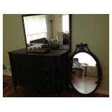 The oval mirror on the right goes with the dresser.