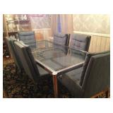 Glass and steel dining set, which has an additional leaf.