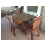 Cottage kitchenette for three with drop-leaf table.