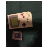 Nintendo Gameboy with tetris cartridge.