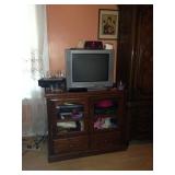 Small glass-front cabinet and TV
