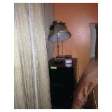 Narrow nightstand and small lamp