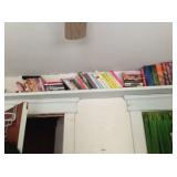 This bookshelf runs along the ceiling -- bring a tall friend.