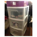 Three-drawer rolling storage unit.