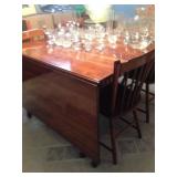Drop-leaf table and assorted glassware.
