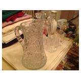 Crystal pitcher and cups.