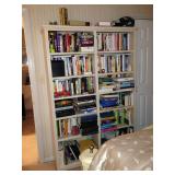 This bookshelf is stacked two deep.