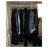 Clothing including formal wear. this house is packed with clothing in a range of sizes.