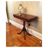 Sofa table and small lamp.