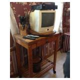 Rolling cart, knife set and small TV.