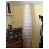 One of a pair of tall fabric lamps