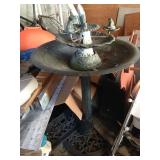 Large metal birdbath with fountain.