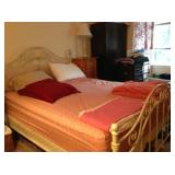 Queen-size bed with metal head and foot boards.