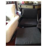 Charcoal gray armchair with ottoman.