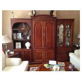 Wall unit with doors, drawers, shelves, space for TV.