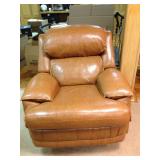 Caramel leather swivel/recliner that goes with living room set