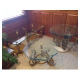 Four glass-topped tables with brass legs