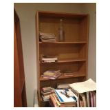 One of many bookshelves. There are books in every room.