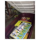 One of a few tubs full of games.