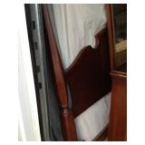 King-sized bed behind full-size headboard